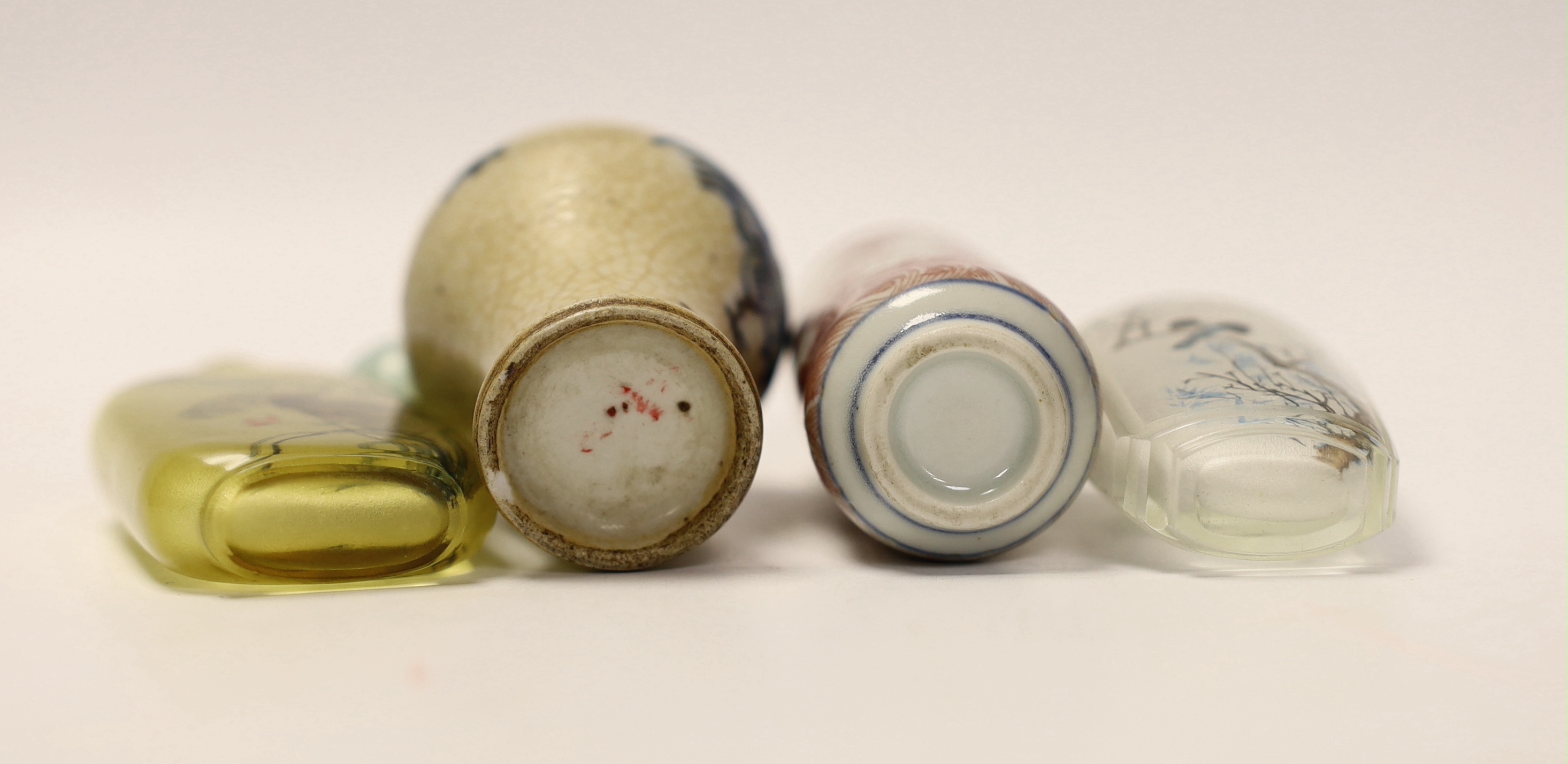 A Chinese crackle glaze snuff bottle, two inside painted glass snuff bottles and an underglaze copper red snuff bottle (4)